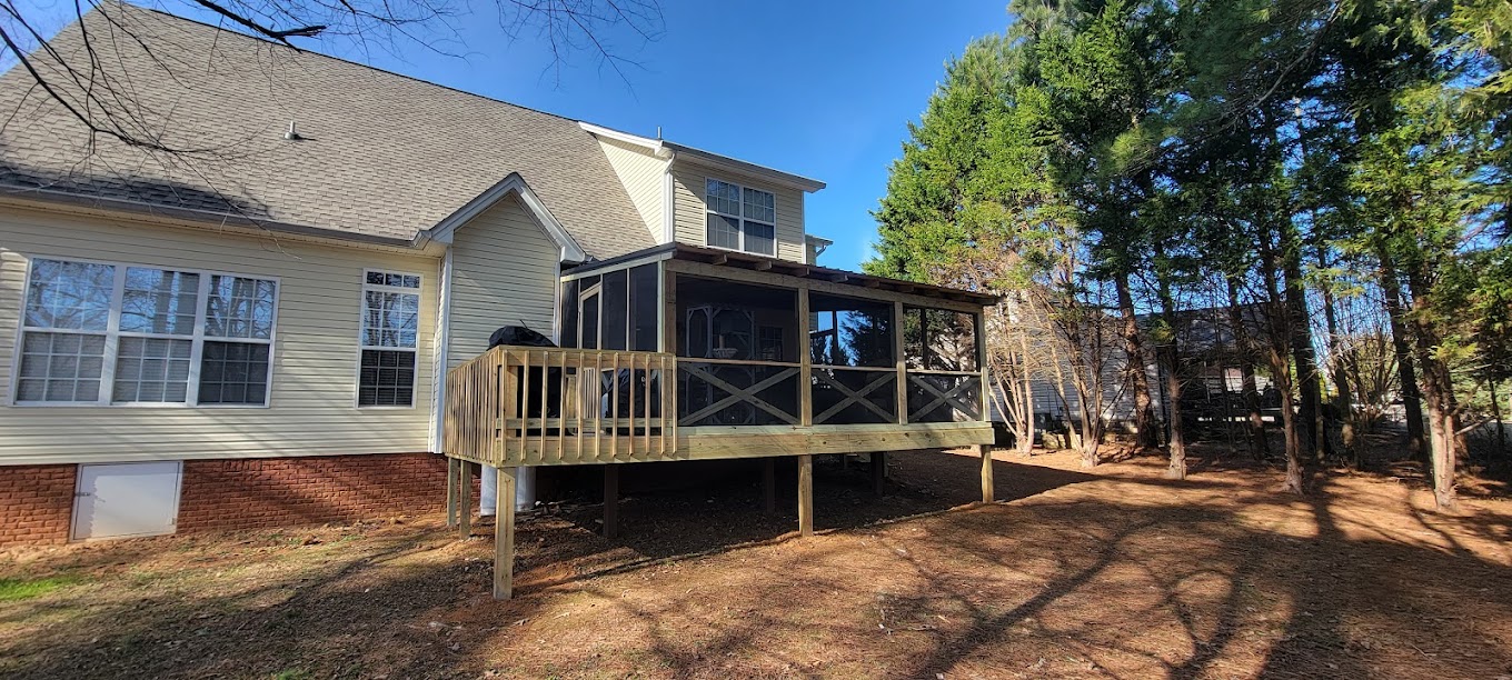 Custom screened deck built onto back of home